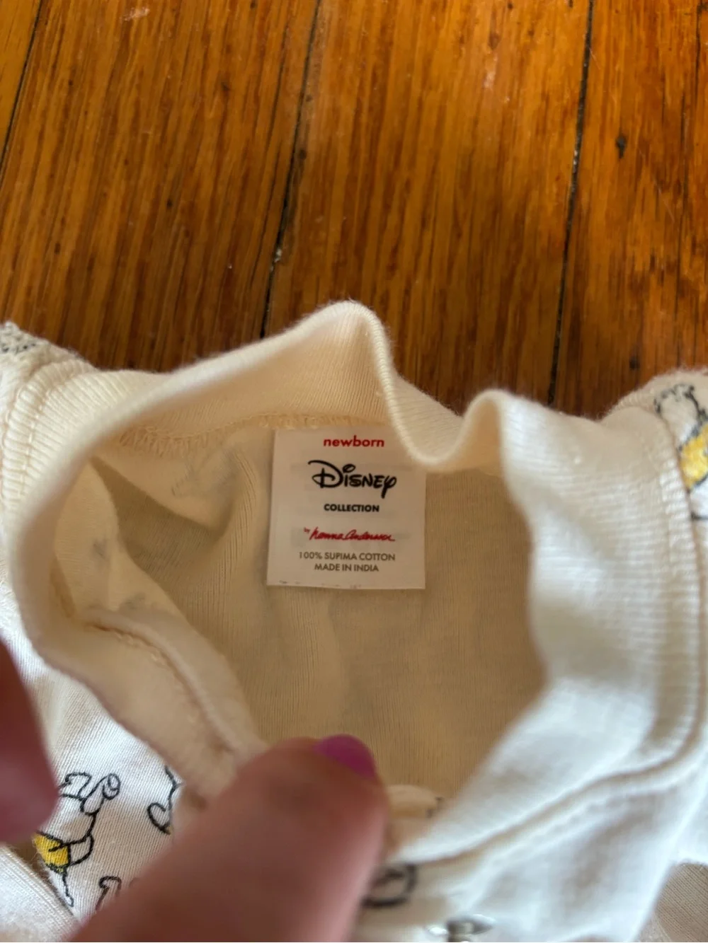 Hanna Andersson Cream Footed One-Piece with Winnie the Pooh.